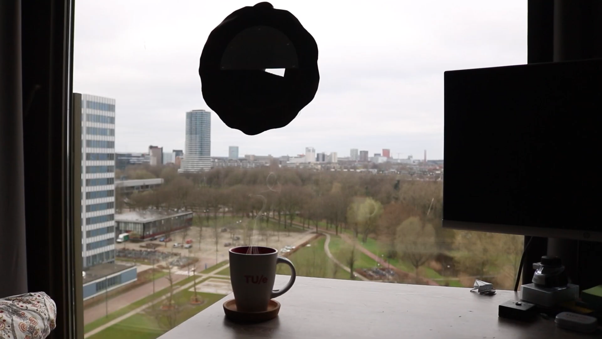 Bulaj — Device mounted on window in living context