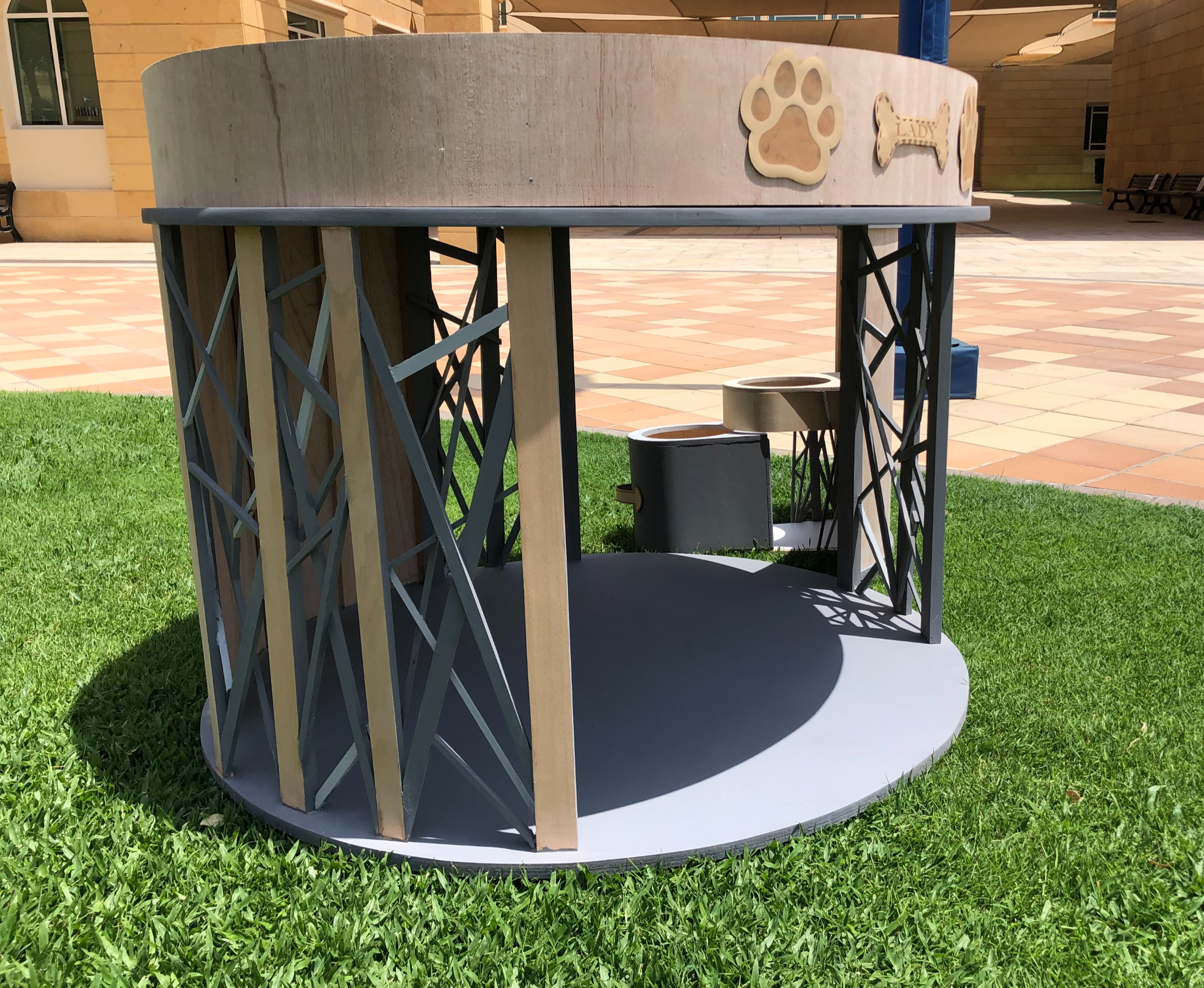 PawHaven — Front view showing lattice structure, food bowls, and open entrance